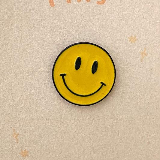 Smiley face pin